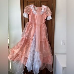 Girls size 12 costume. I bought it for a little bopeep costume for my daughter.